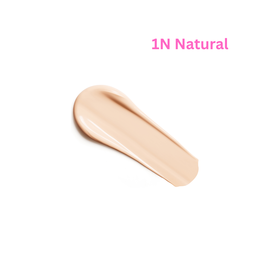 A swatch of liquid foundation in shade 1N Natural, shown as a smooth beige smear on a plain white background with pink text.