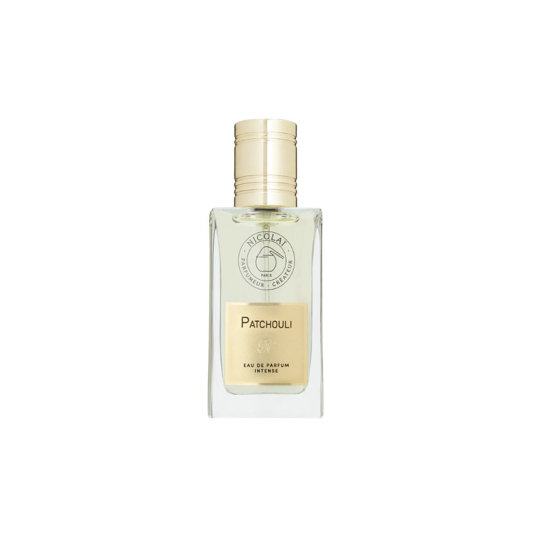 A clear glass bottle of Nicolai Patchouli Eau de Parfum with a gold cap and a gold label, centered on a plain white background.