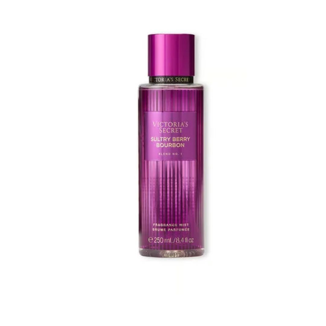 Victoria's Secret Scent of the Room Blazing Berry Bourbon Fragrance Mist in a clear bottle with a metallic magenta cap, on a white background.